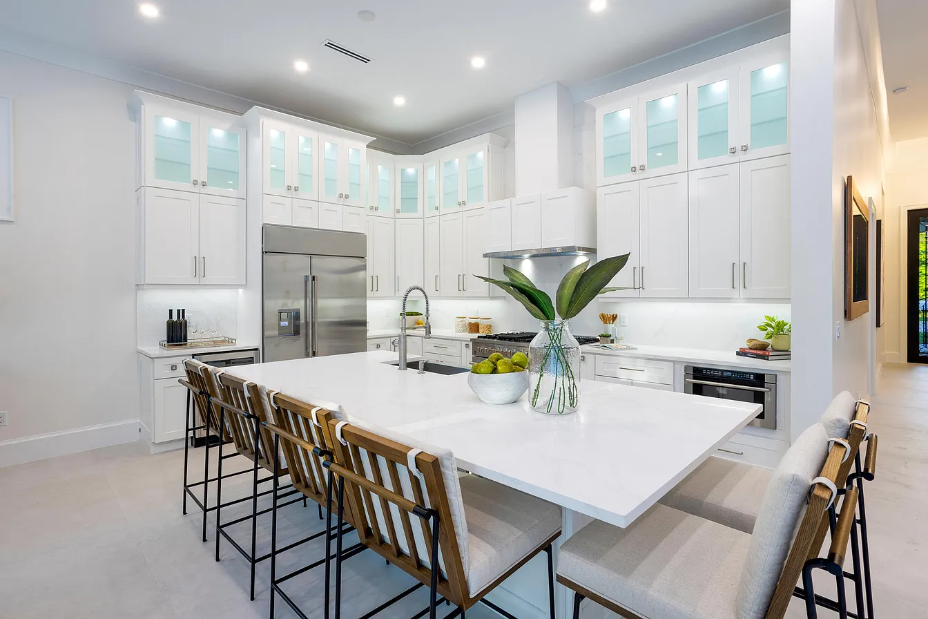 Kitchen with a large island and white cabinetry