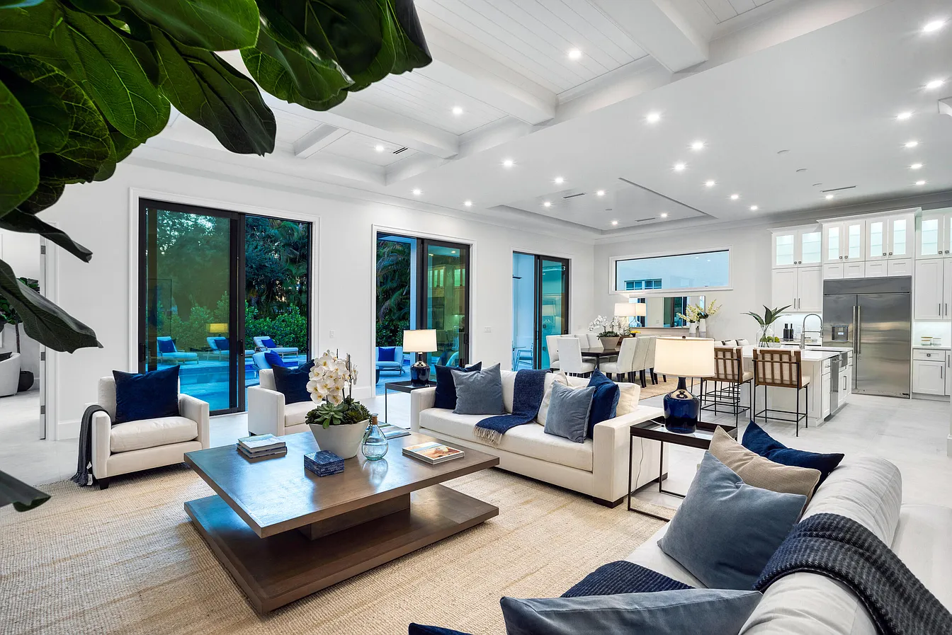 Layered ceiling and warm lighting in the Residential interiors living room